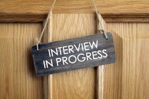 Interview in Progress sign on Door.