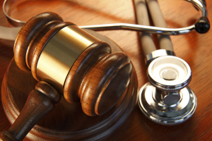 Photograph of a gavel and a stethoscope.